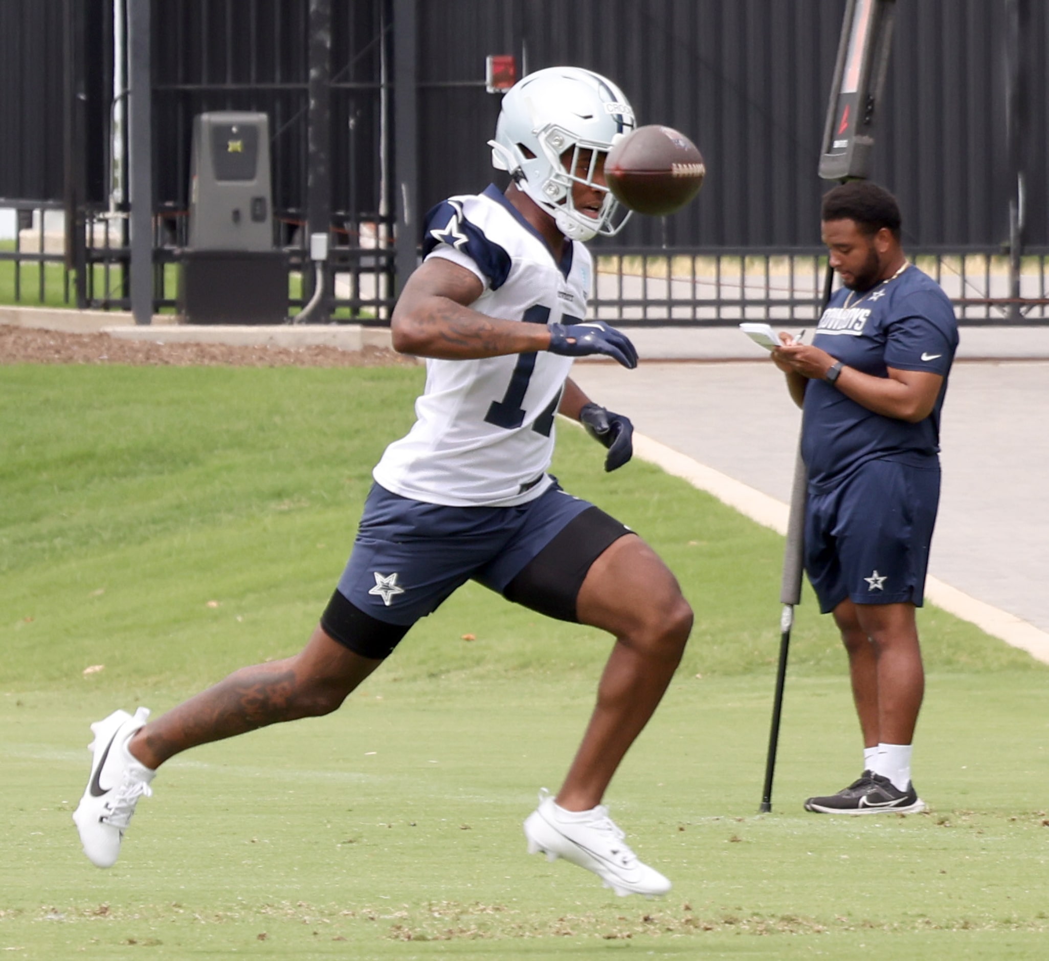 Dallas Cowboys receiver Corey Crooms (17) gets a close-up look at a slightly overthrown ball...