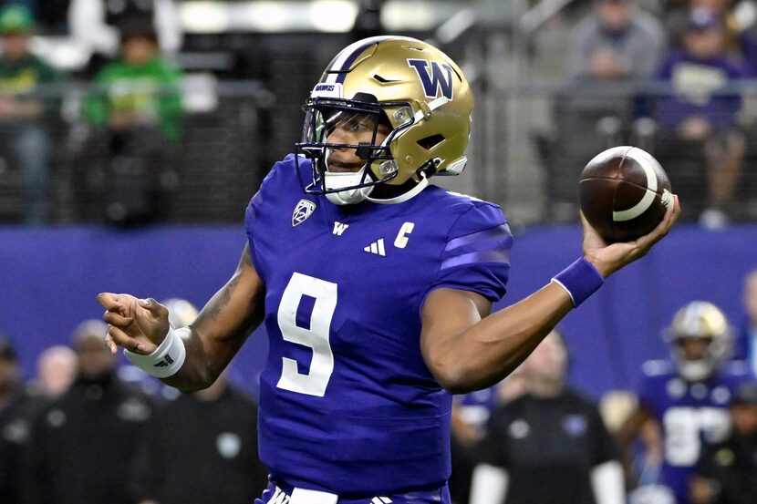 Washington quarterback Michael Penix Jr. looks to pass against Oregon during the first half...