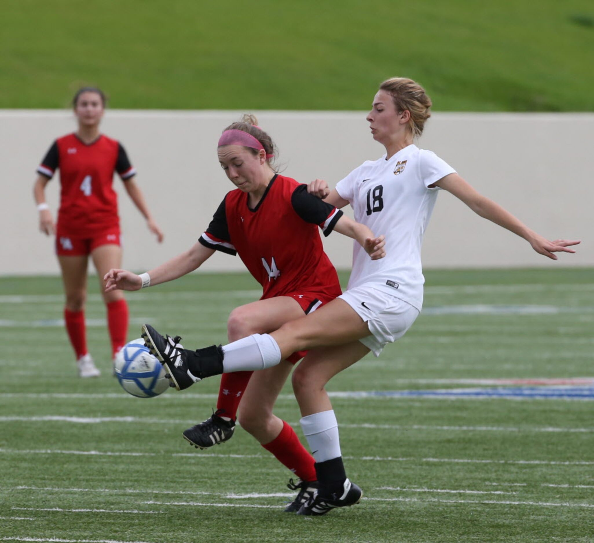 Ursuline Academys Emily Mount (14) and St. Agnes Academys Mary Dade (18) fight for the...