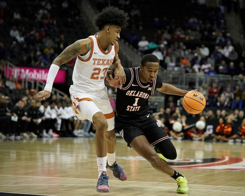 Oklahoma State guard Bryce Thompson (1) drives under pressured by Texas forward Dillon...