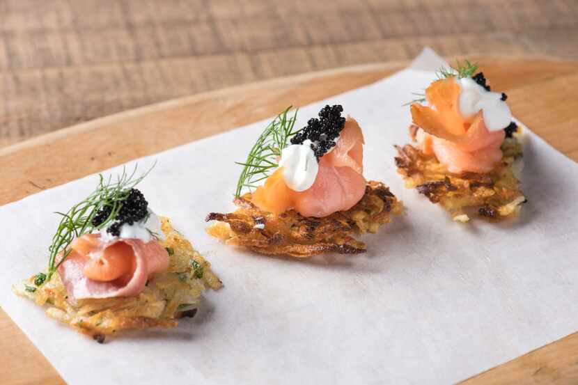 Victory Tavern's smoked salmon potato cake is artistically topped with caviar and dill.