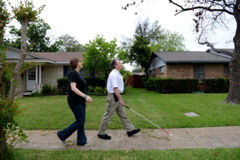 David and Anita Morehead walk from their home on Burning Tree Lane and walk toward the...