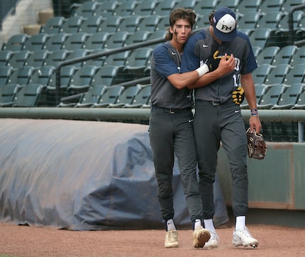 Flower Mound  Ryder McDaniel, (4), gives Jacob Gholston, (11), a hug before the start of...