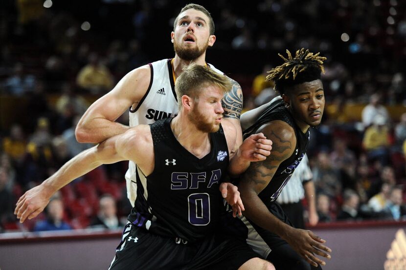 Dec 22, 2015; Tempe, AZ, USA; Stephen F. Austin Lumberjacks forward Thomas Walkup (0) and...