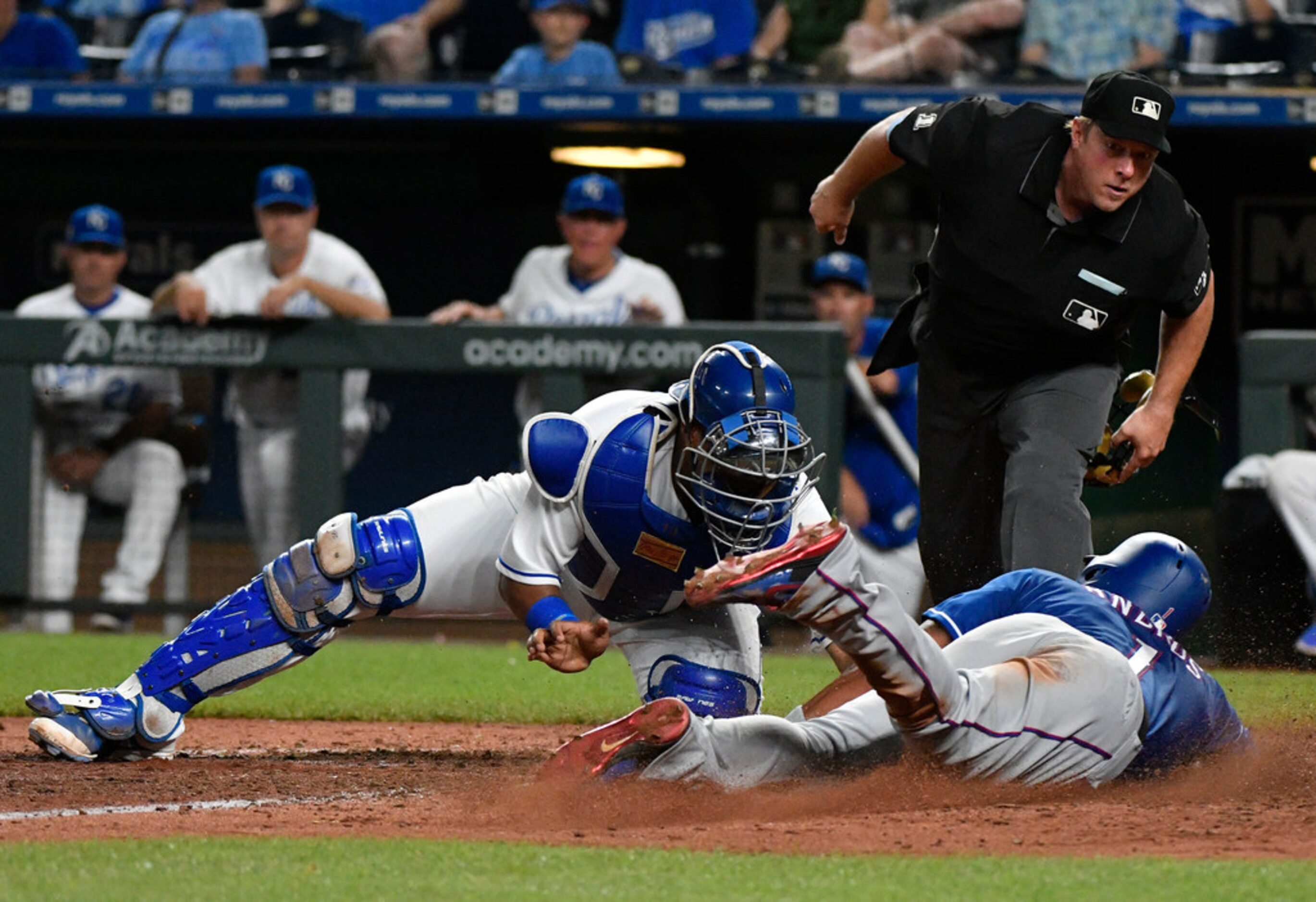 KANSAS CITY, MO - JUNE 19: Elvis Andrus #1 of the Texas Rangers is tagged out at home as he...