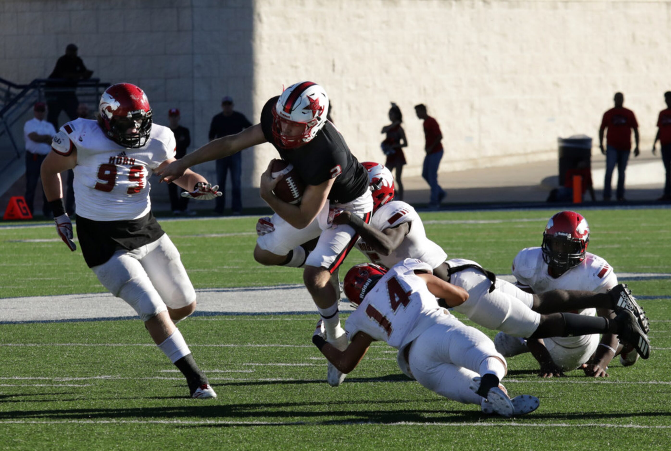 Coppell player 2, Brady McBride, runs the ball during a Class 6A division I playoff game...