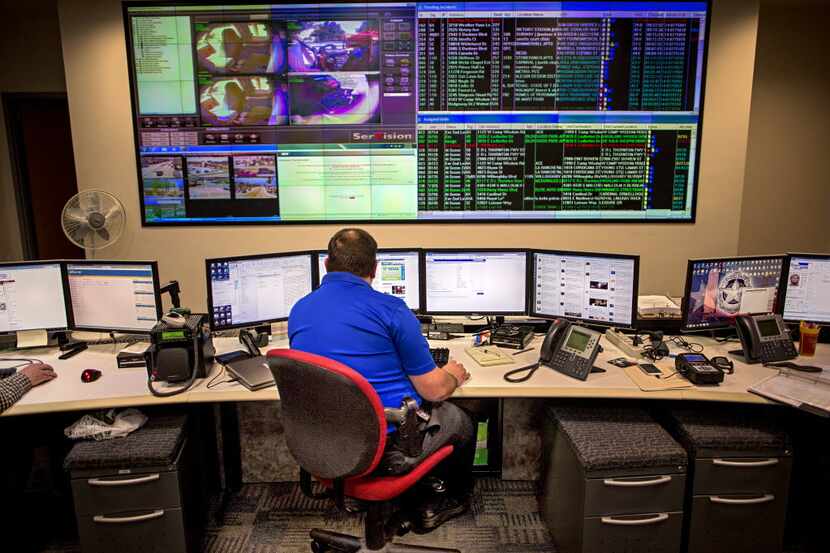 A Dallas police detective monitors screens at the DPD Fusion Center. DPD, like most police...