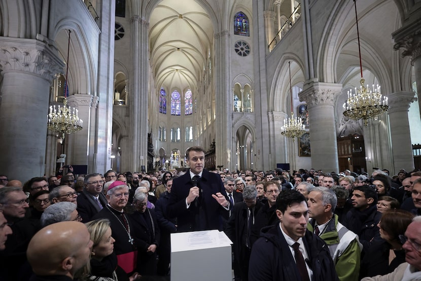 French President Emmanuel Macron delivers a speech inside Notre-Dame cathedral after...