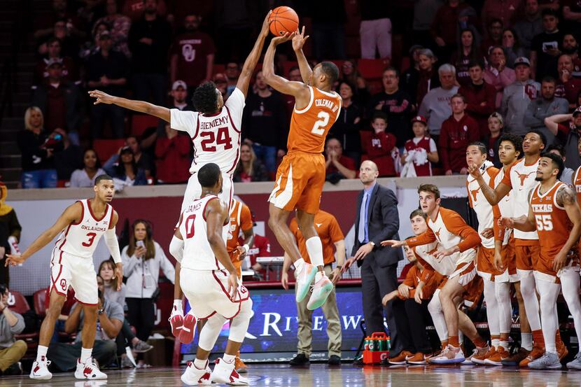 Oklahoma's Jamal Bieniemy (24) blocks a last-second shot by Texas' Matt Coleman III (2)...