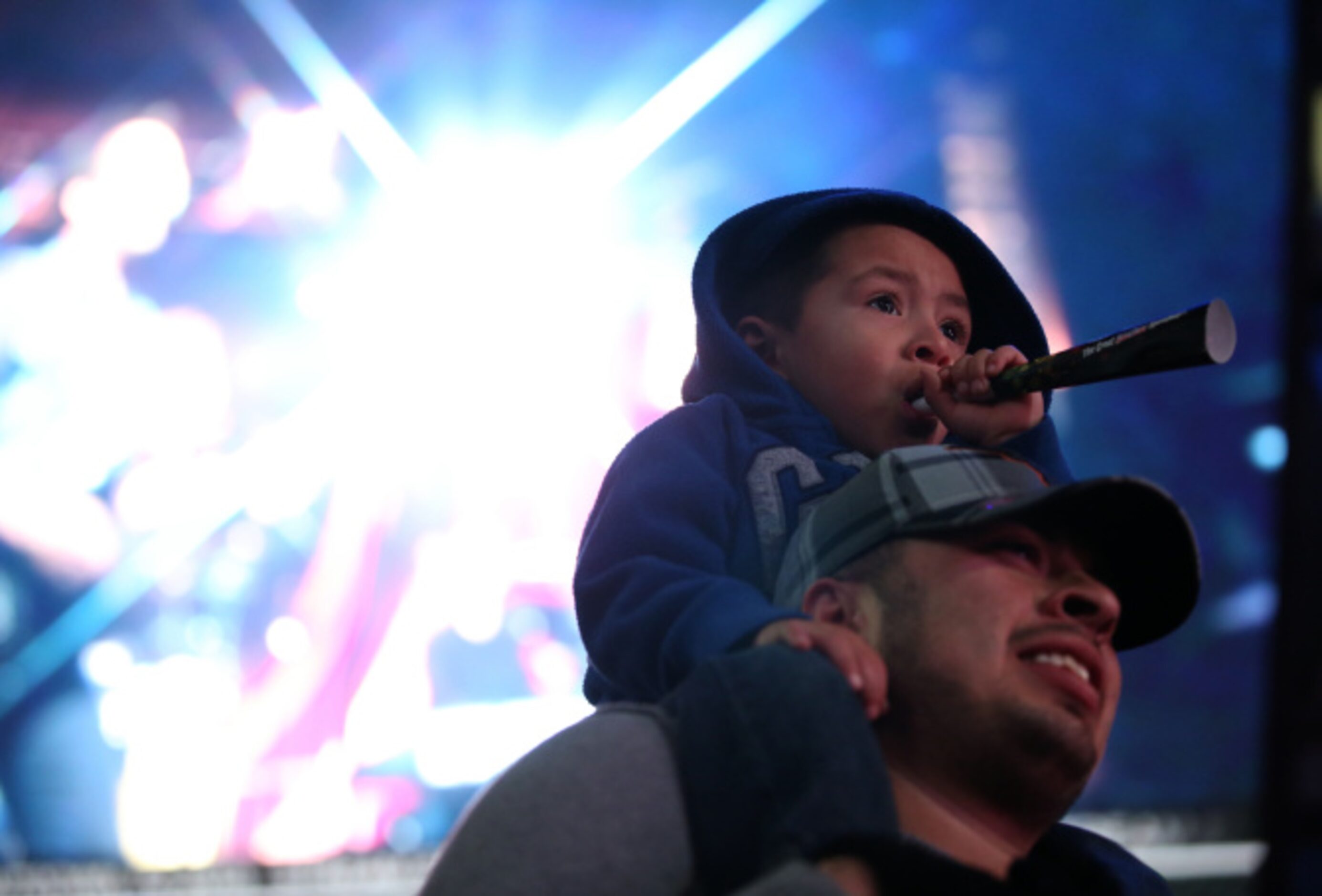 Kody Johan Martinez, 3, and his father Alfredo Martinez celebrate during Big D New Years Eve...