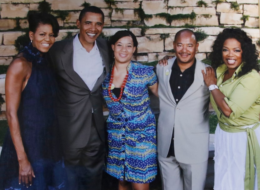 Copy shot of a picture of Kneeland Youngblood and his daughter Devon, center with the...