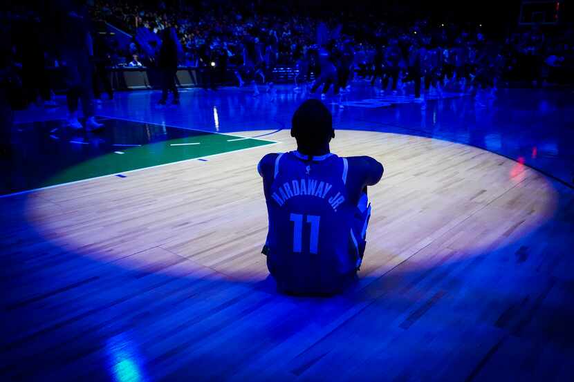 Dallas Mavericks forward Tim Hardaway Jr. watches pregame introductions before an NBA...