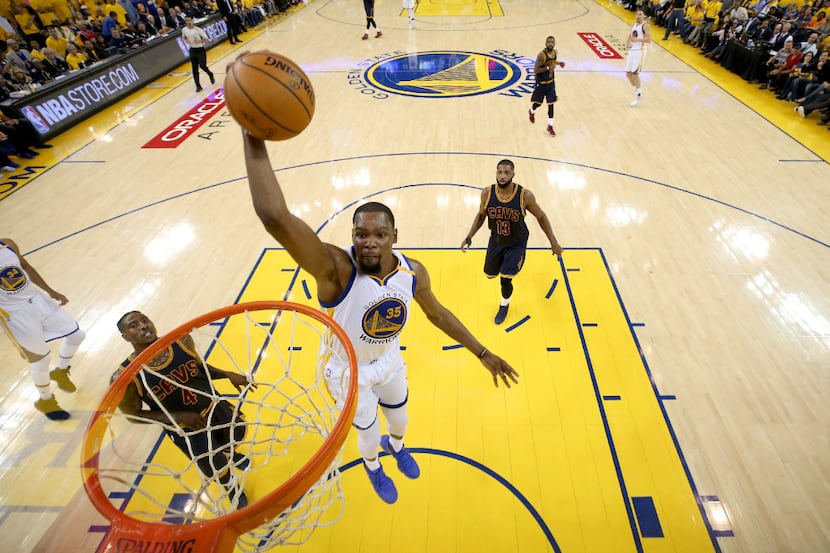 OAKLAND, CA - JUNE 01:  Kevin Durant #35 of the Golden State Warriors dunks the ball against...