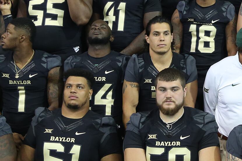 Baylor seniors Jarell Broxton (61) and Spencer Drango (58), side-by-side in a Baylor team...