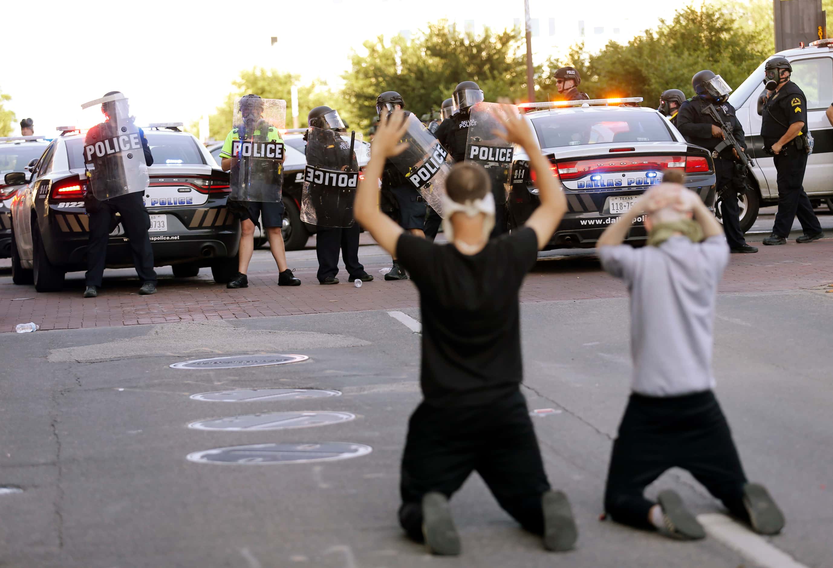 Protesters and Dallas police at Young Street and Akard during a demonstration against police...