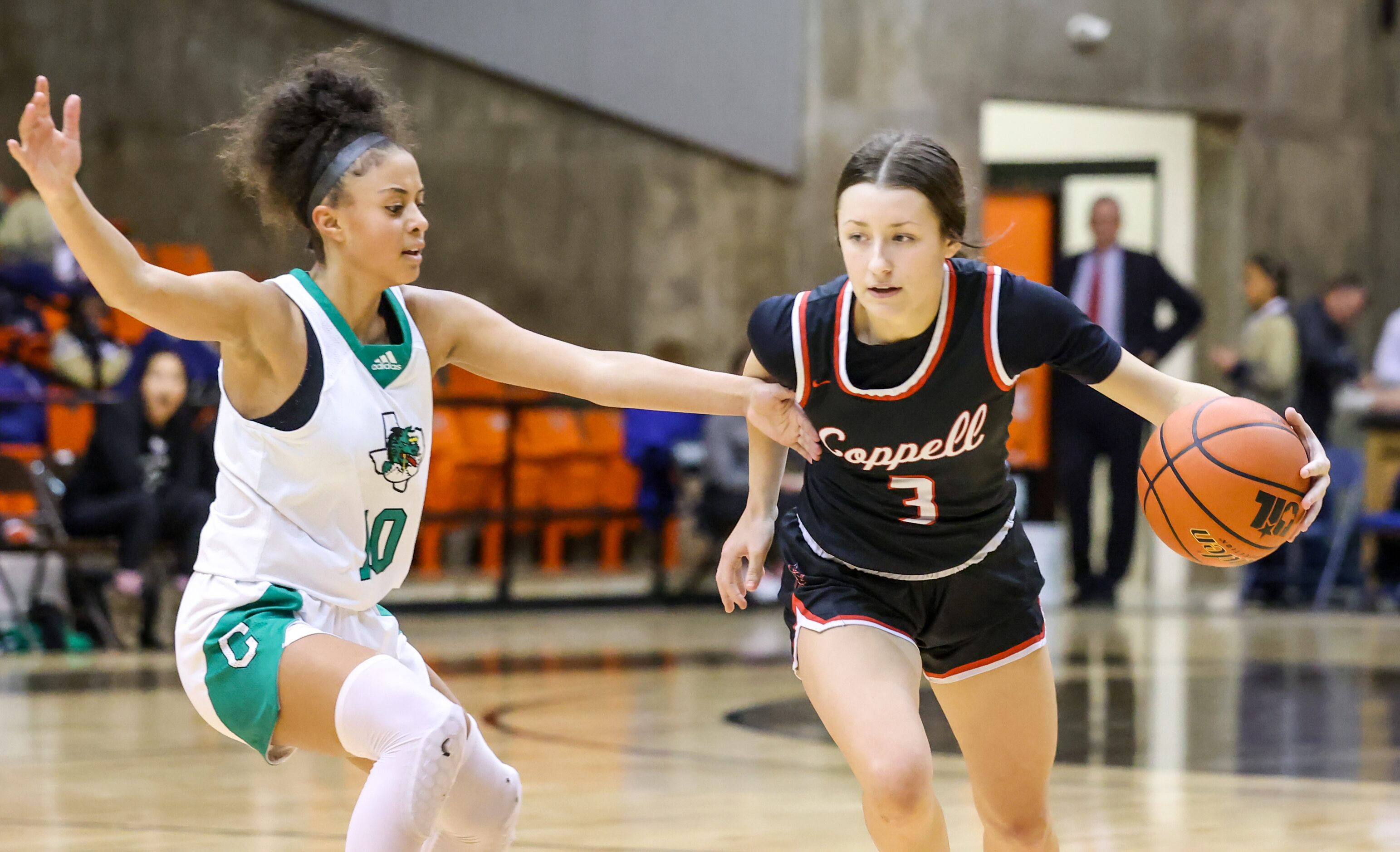 Southlake Carroll freshman guard Gianna Jordan (10) places a hand out to block Coppell...