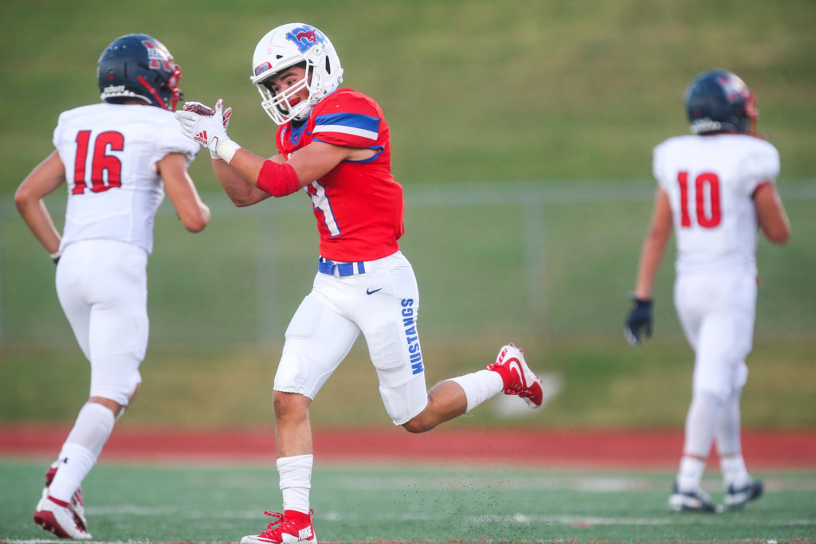 Grapevine defensive back Jack Turner celebrates after his team recovered a fumble during the...