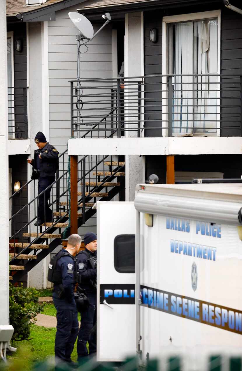 Dallas police work at The Hive Apartments at 6003 Abrams Road in Dallas, where two young...