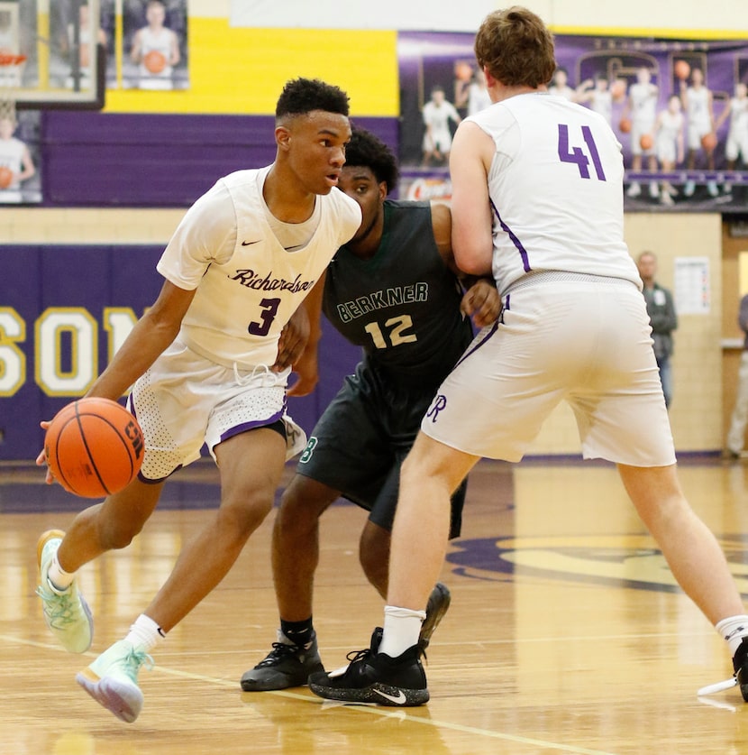 Richardson's Rylan Griffen (3) maneuvers to the basket as Richardson Berkner defender Micah...