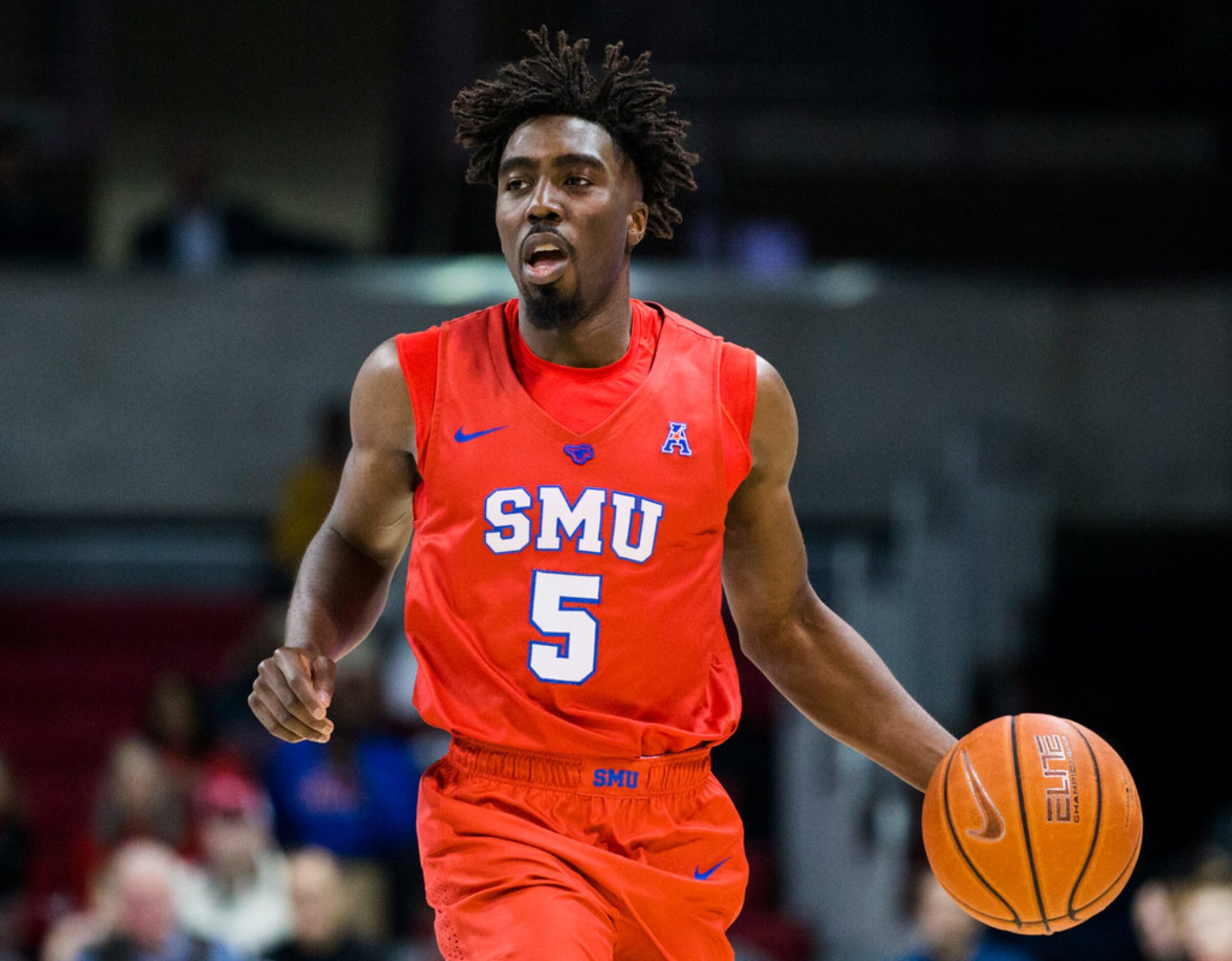 Southern Methodist Mustangs guard Emmanuel Bandoumel (5) takes the ball down the court...