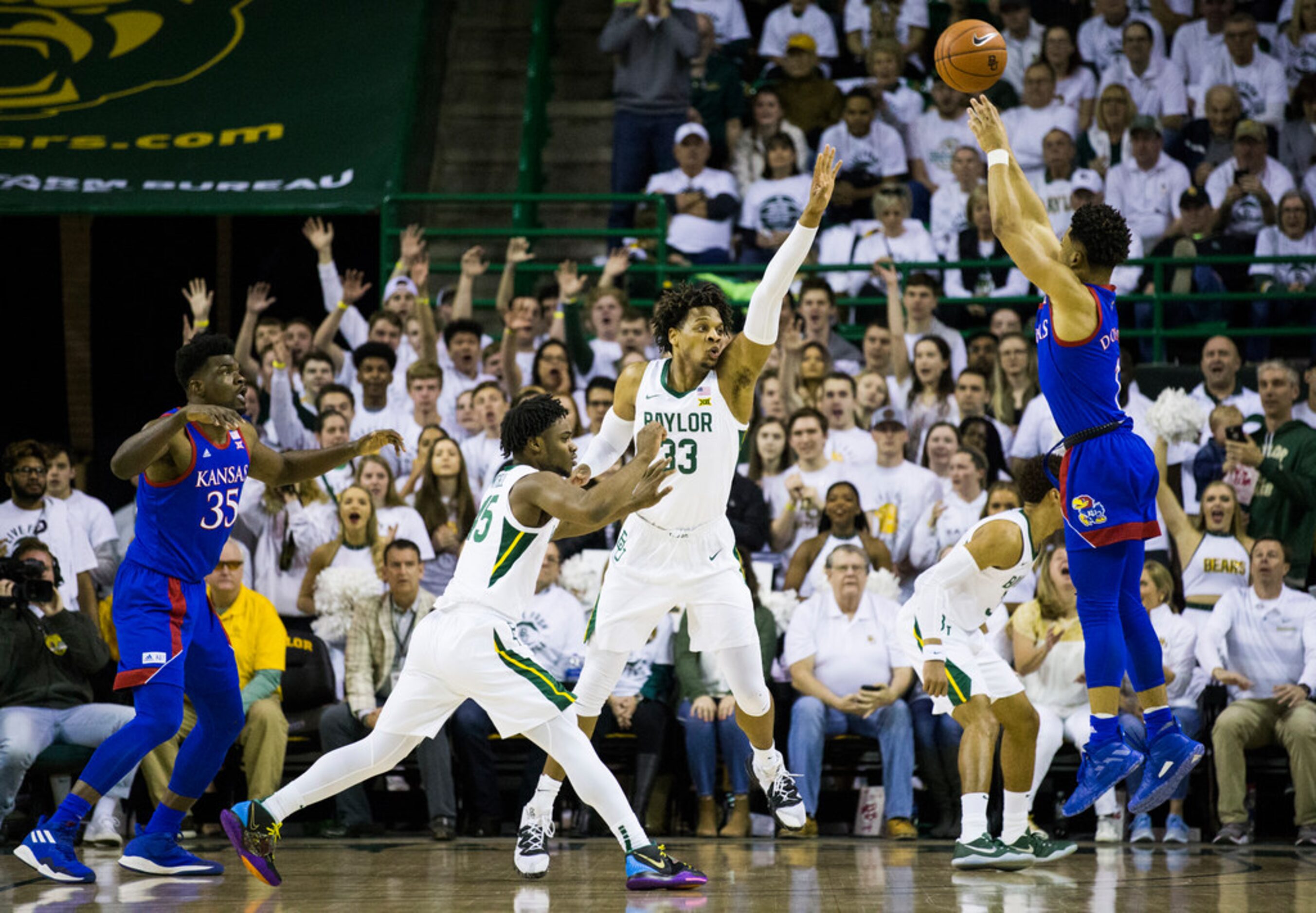 Baylor Bears forward Freddie Gillespie (33) and guard Davion Mitchell (45) defend against...