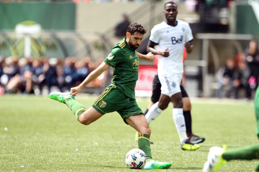 Portland Timbers' Diego Valeri, foreground, lines up a shot during an MLS soccer game...