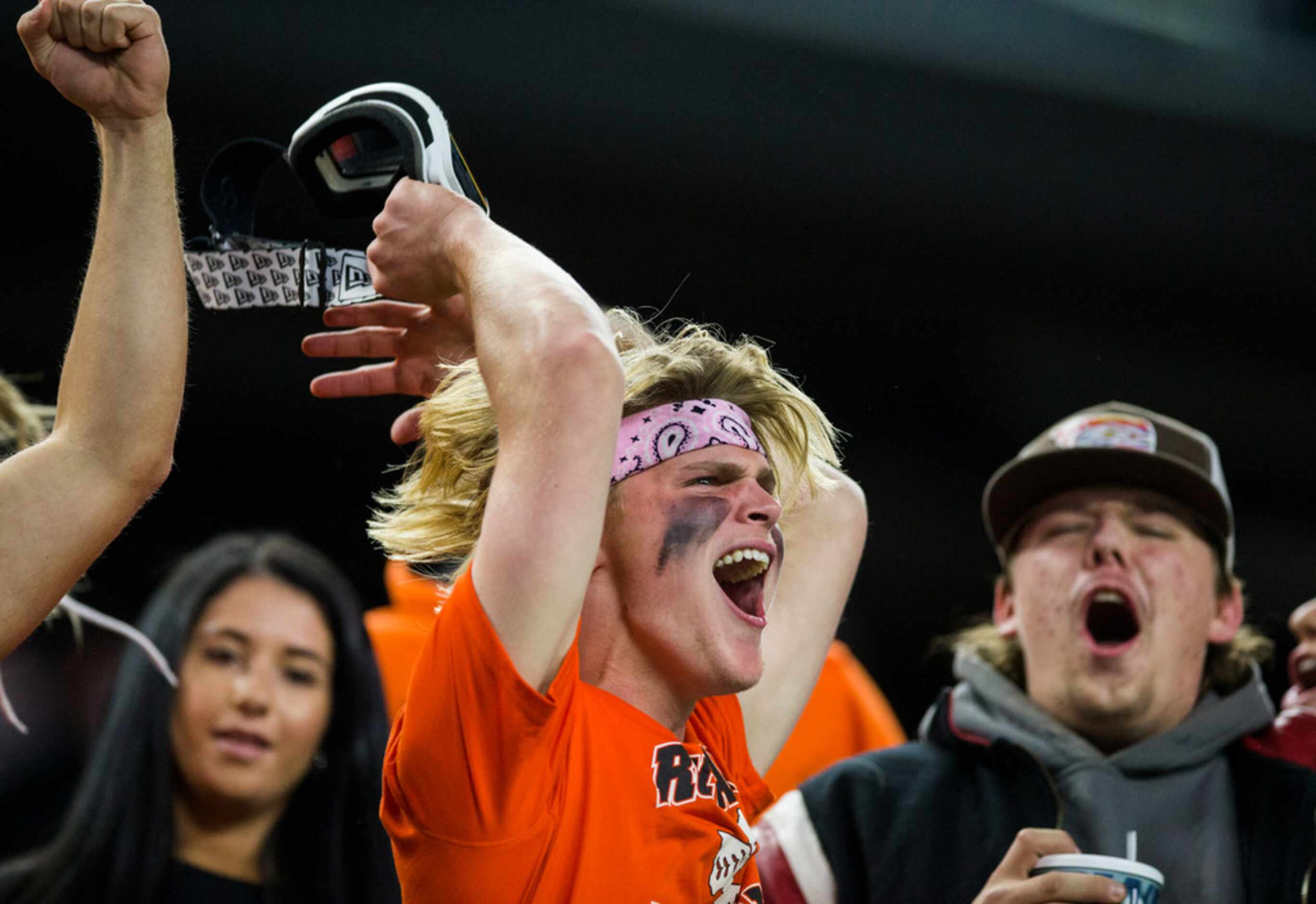 Rockwall fans cheer during the fourth quarter of a Class 6A Division I area-round high...