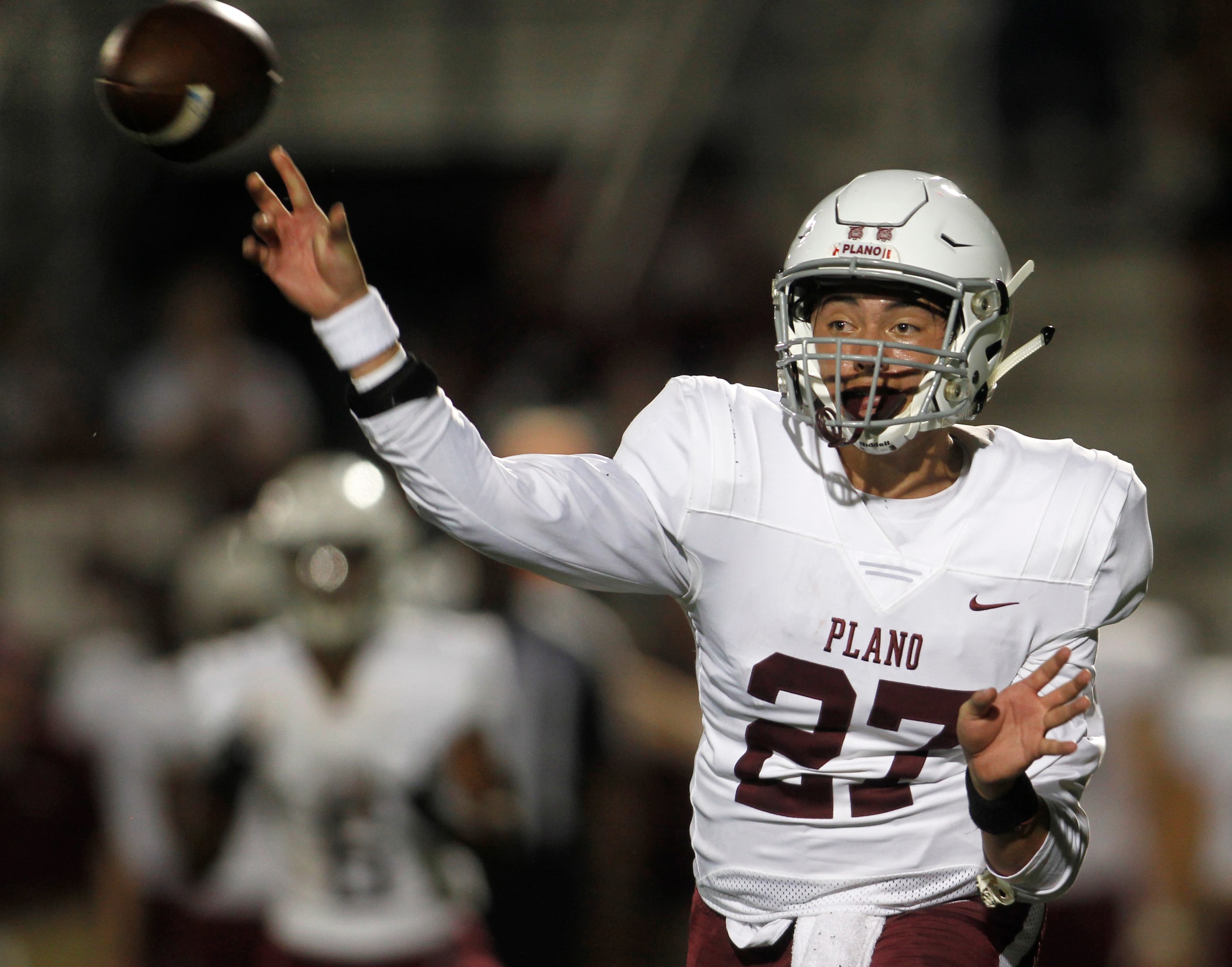 Plano quarterback Austin Gonzalez (27) releases a pass during second quarter action against...