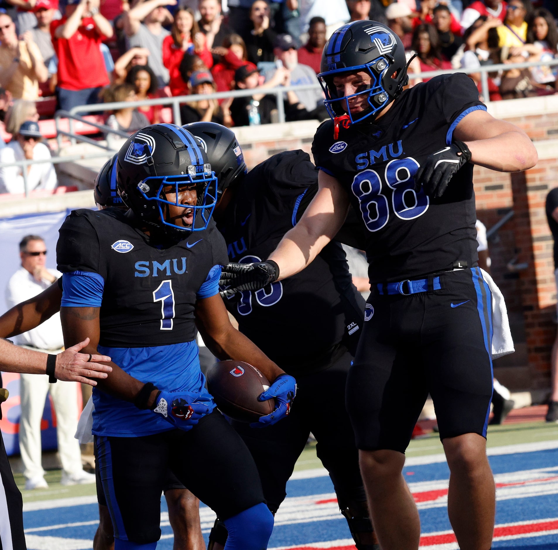 SMU running back Brashard Smith (1) celebrates with his teammate SMU tight end Matthew...