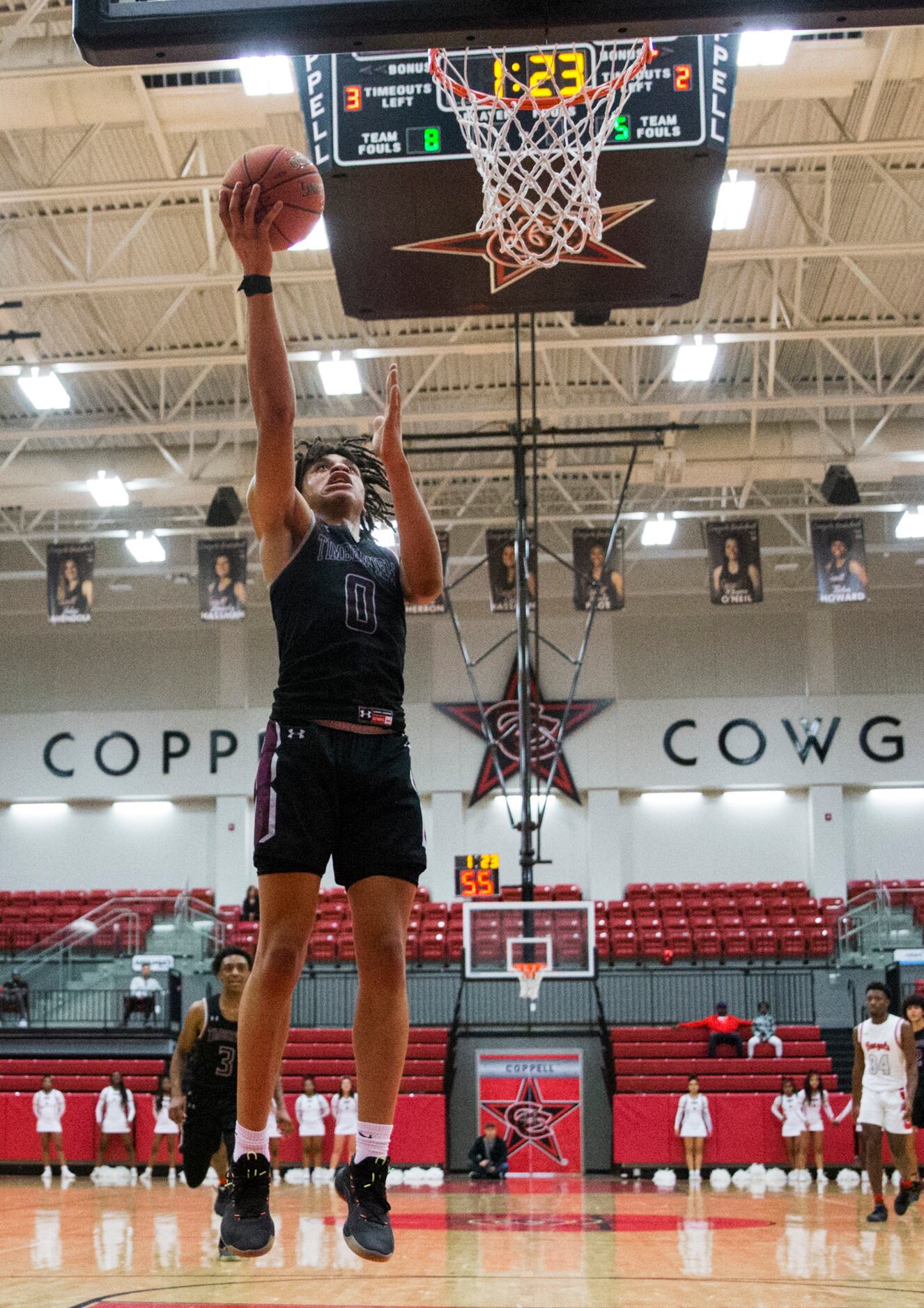 Mansfield Timberview guard Joey Madimba (0) goes up for a shot by himself during the fourth...