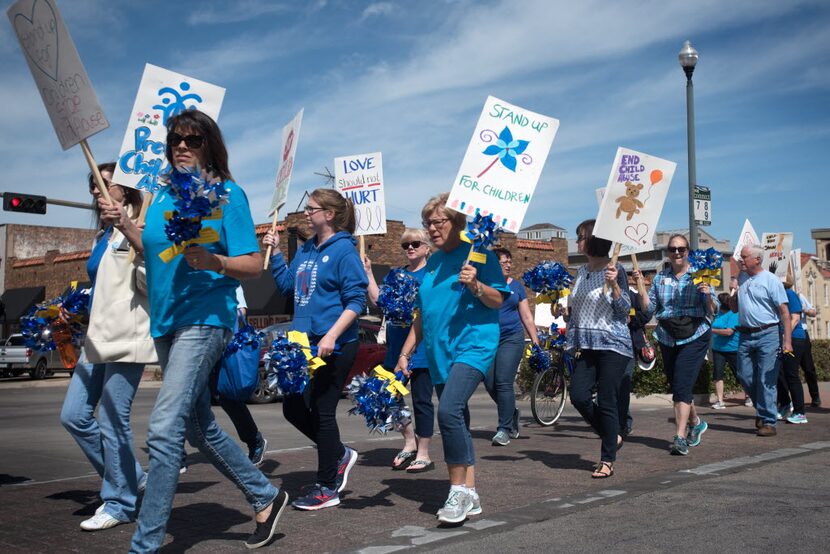 Court Appointed Special Advocates of Denton County marched from the Denton Civic Center to...