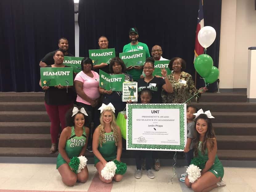 Jordin Phipps, 8, was surrounded by her family and UNT cheerleaders at her Garland school,...