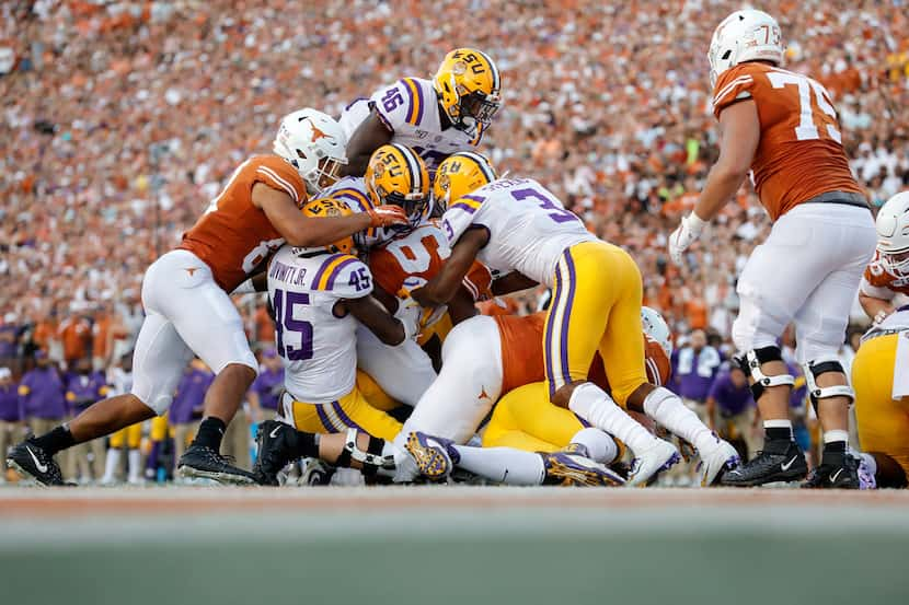 AUSTIN, TX - SEPTEMBER 07:  Keaontay Ingram #26 of the Texas Longhorns is stopped short of...