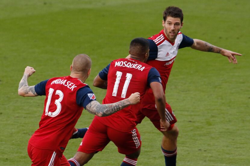 FC Dallas' Ryan Hollingshead (12) appears to point to a point of celebration gathering to...