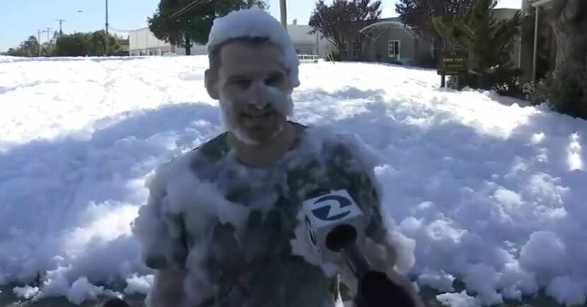 A California man being interviewed after riding a bicycle through the foam blob in Santa Clara.
