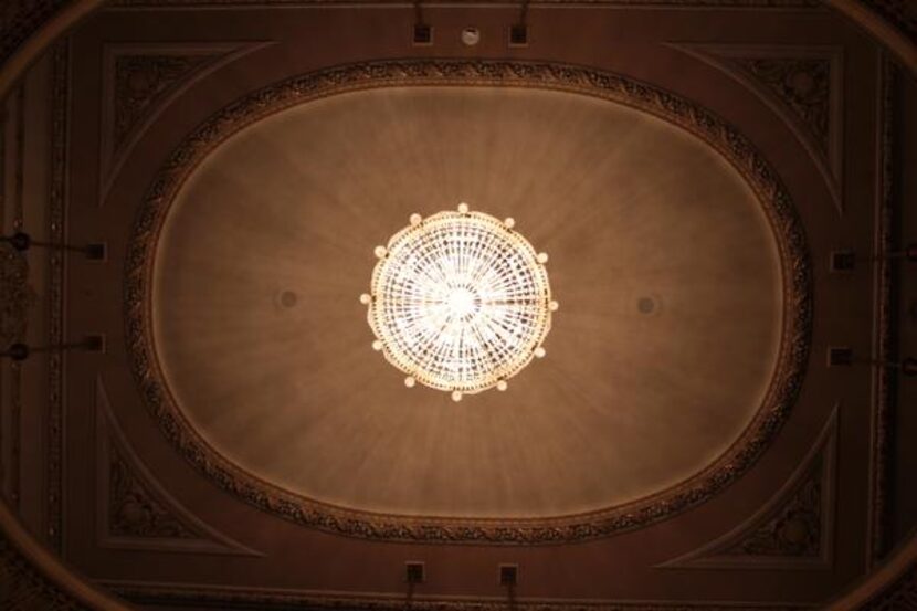 
A chandelier lights the lobby of Dallas’ Majestic Theatre. Though still able to accommodate...