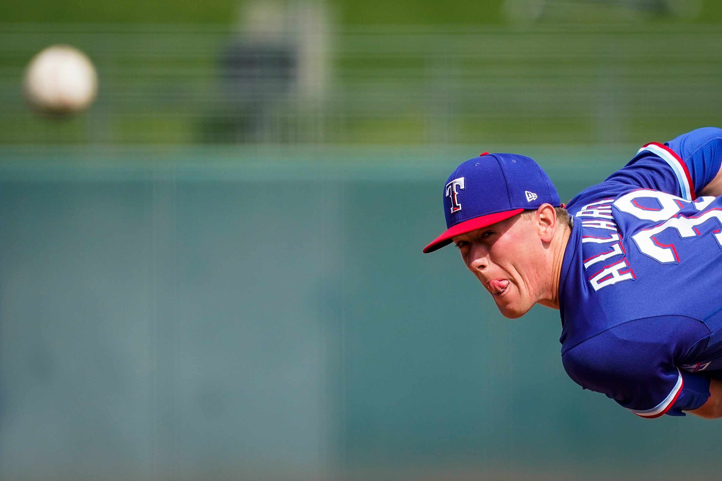 Texas Rangers starting pitcher Kolby Allard pitches during the first inning of a spring...