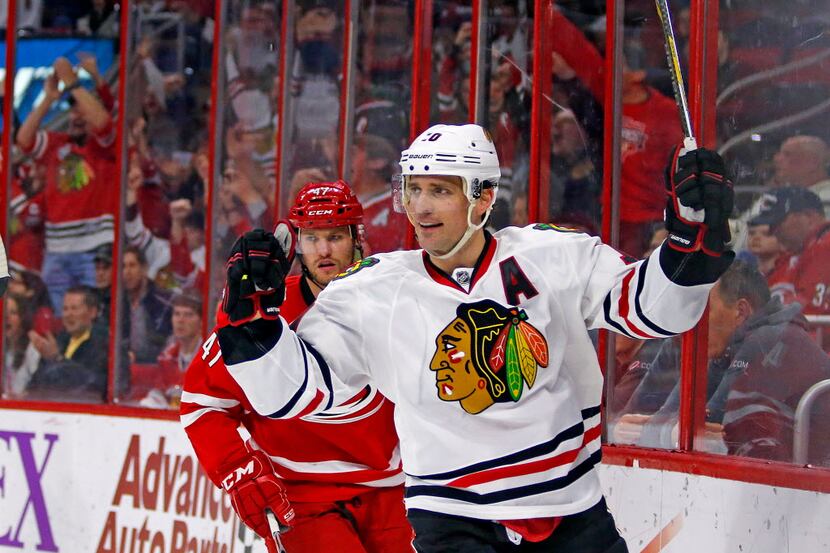 FILE - In this March 23, 2015, file photo, Chicago Blackhawks' Patrick Sharp (10) celebrates...