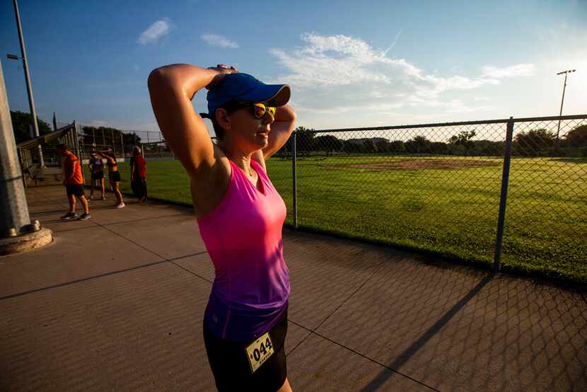 Amie Goins catches her breath after completing a 5K with the Carrollton Runners Club. She ...