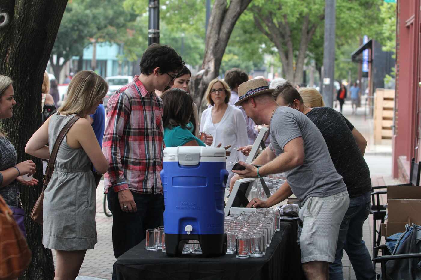 People gathered outside Kettle Art on Main Street to sign up for the Deep Ellum Wine Walk...