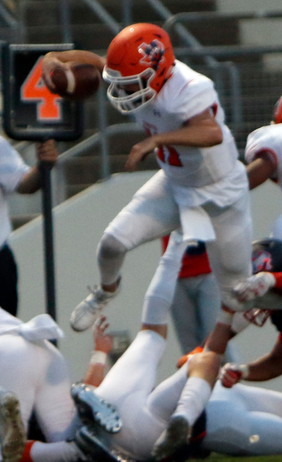 McKinney North quarterback Hayden Richardson (11) high steps his way into the end zone for a...