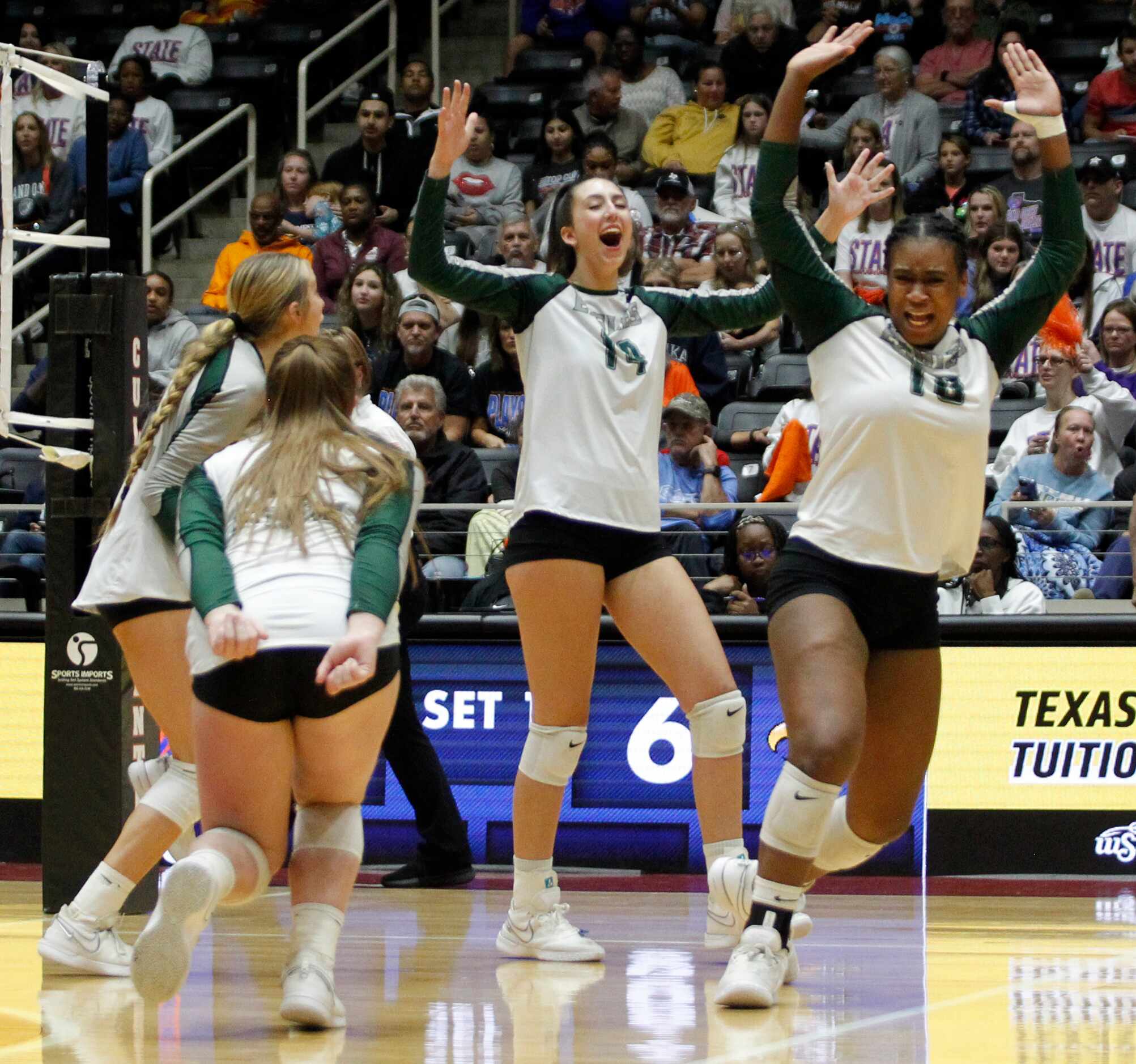Prosper players Audrey Hunt (14), center, and Hannah Beauford (10), right, celebrate a...