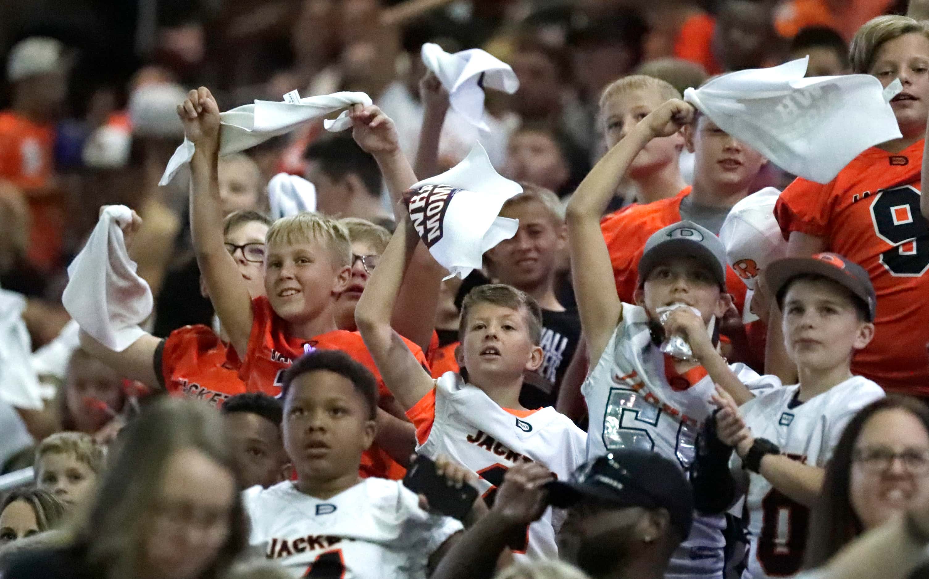 Rockwall High School fans celebrate a touchdown during the first half as Rockwall High...