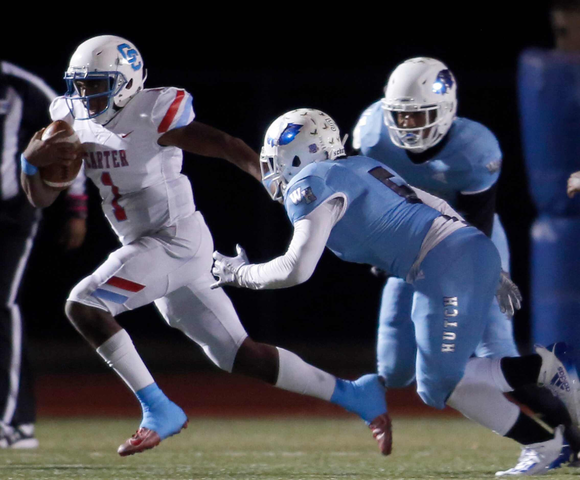 Dallas Carter quarterback Kase Williams (1) avoids the defensive pressure from Wilmer...