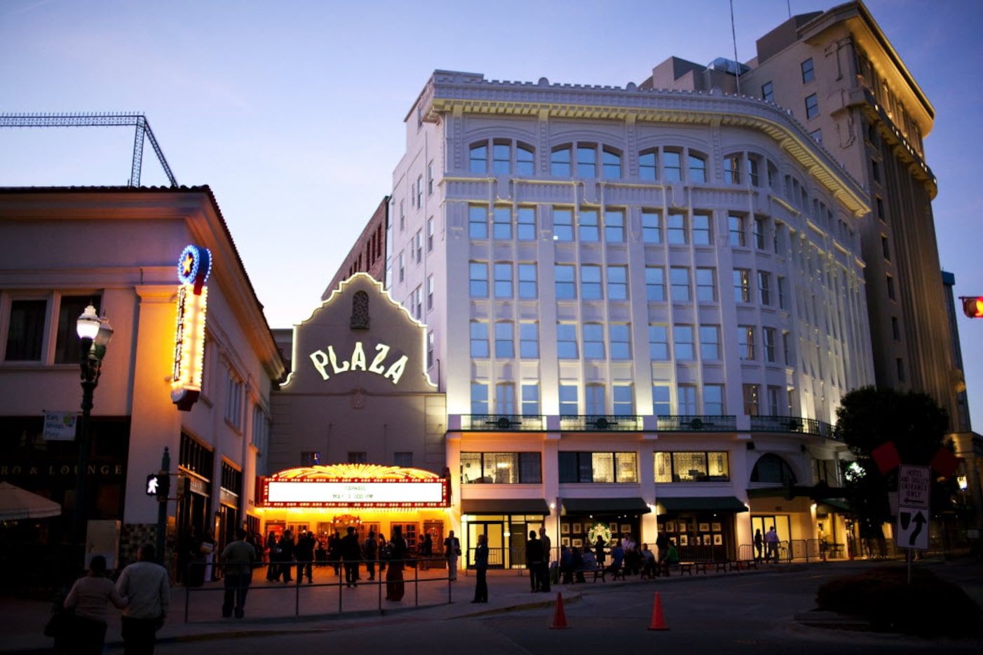 A crowd outside of the Plaza Theater, which stands beside the newly renovated Anson Mills...