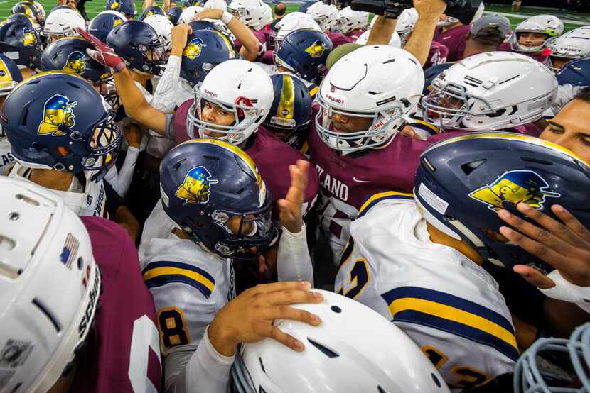 Players from Plano and El Paso Eastwood HIgh Schools meet at midfield before a high school...