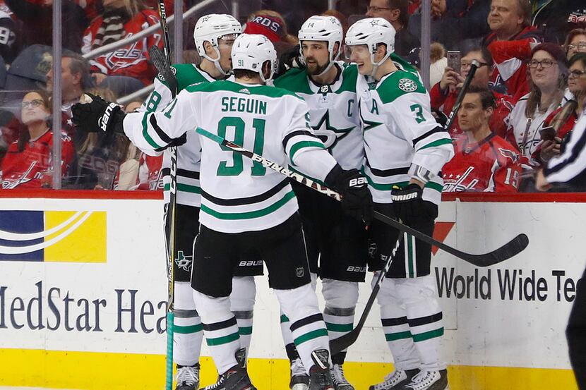 Dallas Stars left wing Jamie Benn, second from right, celebrates his goal against the...