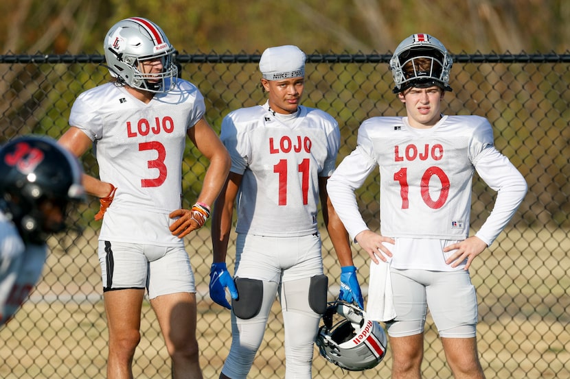 Lovejoy wide receivers Parker Livingstone (left) and Daylan McCutcheon (center) watch a...