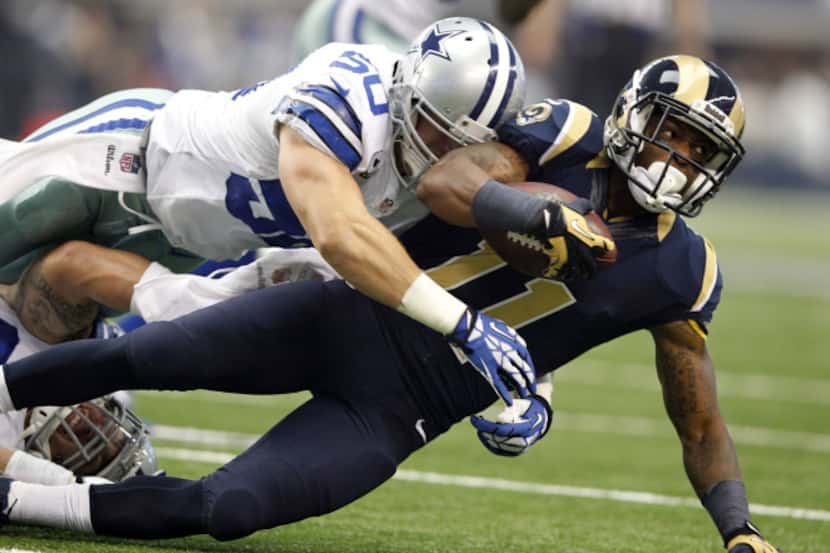 Dallas Cowboys middle linebacker Sean Lee (50) tackles St. Louis Rams wide receiver Tavon...