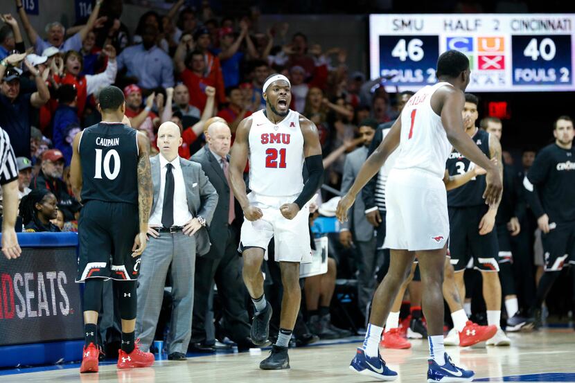 SMU guard Ben Emelogu II (21) was pumped up as the Mustangs took charge in Sunday's game at...